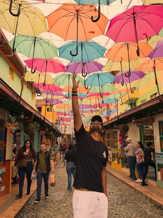 Walking through a rainbow Guatap really said let s make every street a photo op and I m not mad about it The most colorful town in Colombia didn t disappoint Calle de los Paraguas, Guatap #guatape #colombia #colombiatravel #umbrellastreet #callelosparaguas medellin colombiana colorfulplaces travelcolombia southamerica visitcolombia pueblitosdeantioquia colombiagram travelgram wanderlust instatravel beautifuldestinations passionpassport travelphotography streetphotography colorful rainbow umbrella exploremore discovercolombia antioquia pueblopatrimonio colombiaesrealismom gico atlanta travelreels